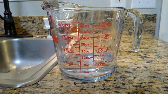 4 cup glass measuring cup filled 1 cup water