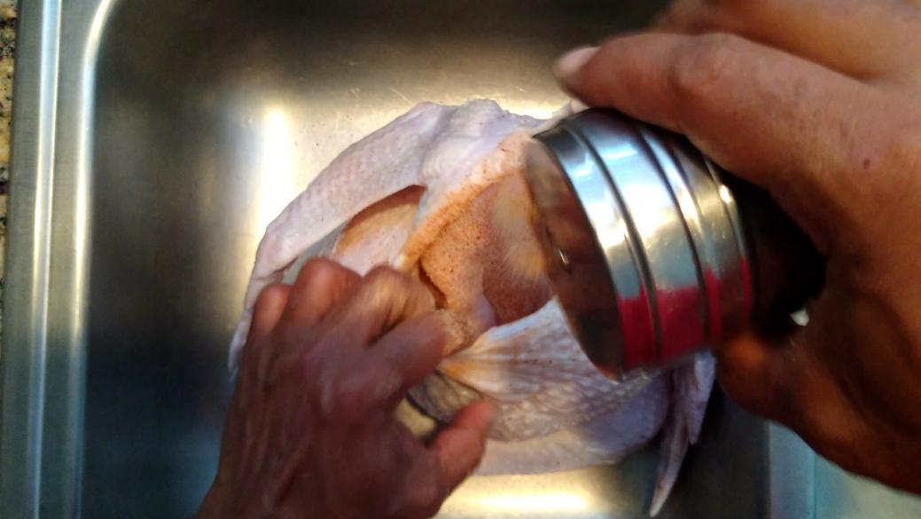 Seasoning the top of the Turkey breast